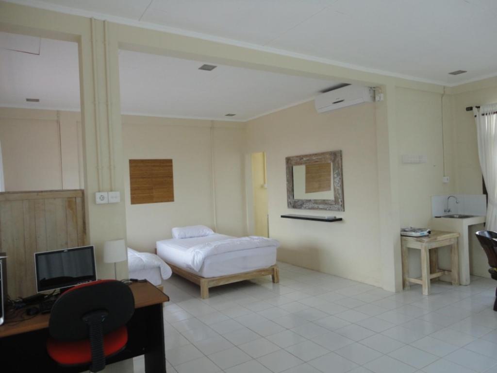Urbanview Hotel Wayan Mansion دنباسار الغرفة الصورة